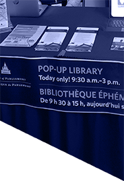 Pop-up library table with Library of Parliament products