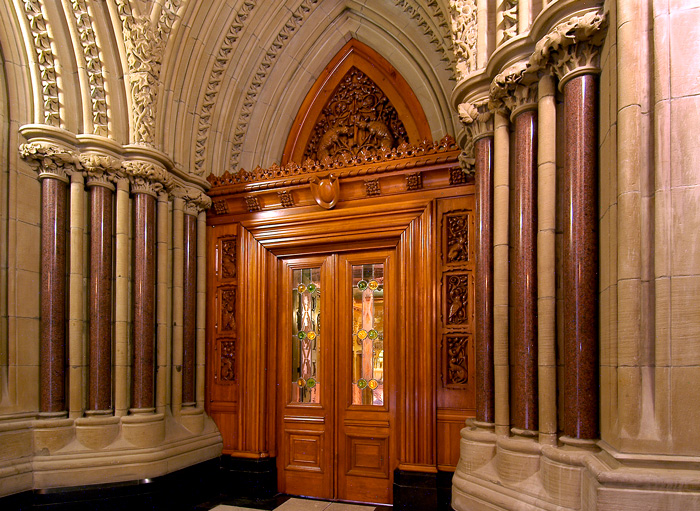 Library entrance seen from Centre Block – showing the woodwork and arches that surround it.