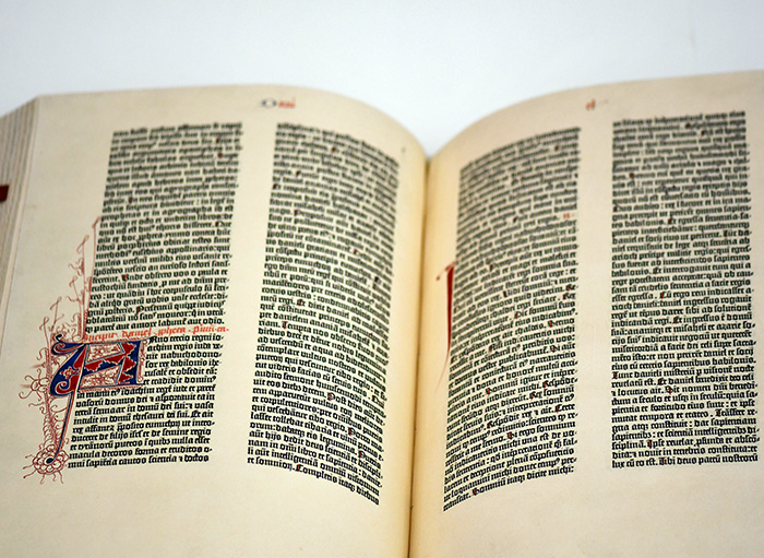 A page showing the typeface and hand-drawn illumination