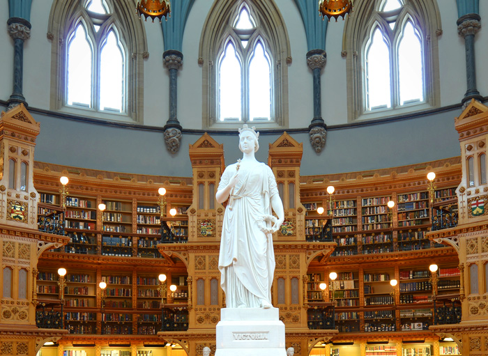 Statue of Queen Victoria and the dome of the Library